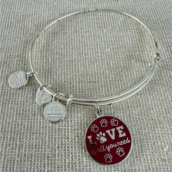 Alex and Ani Jewelry - Silver Tone Expandable Bracelet with Red 'LOVE is all you need' Paw Print Charm